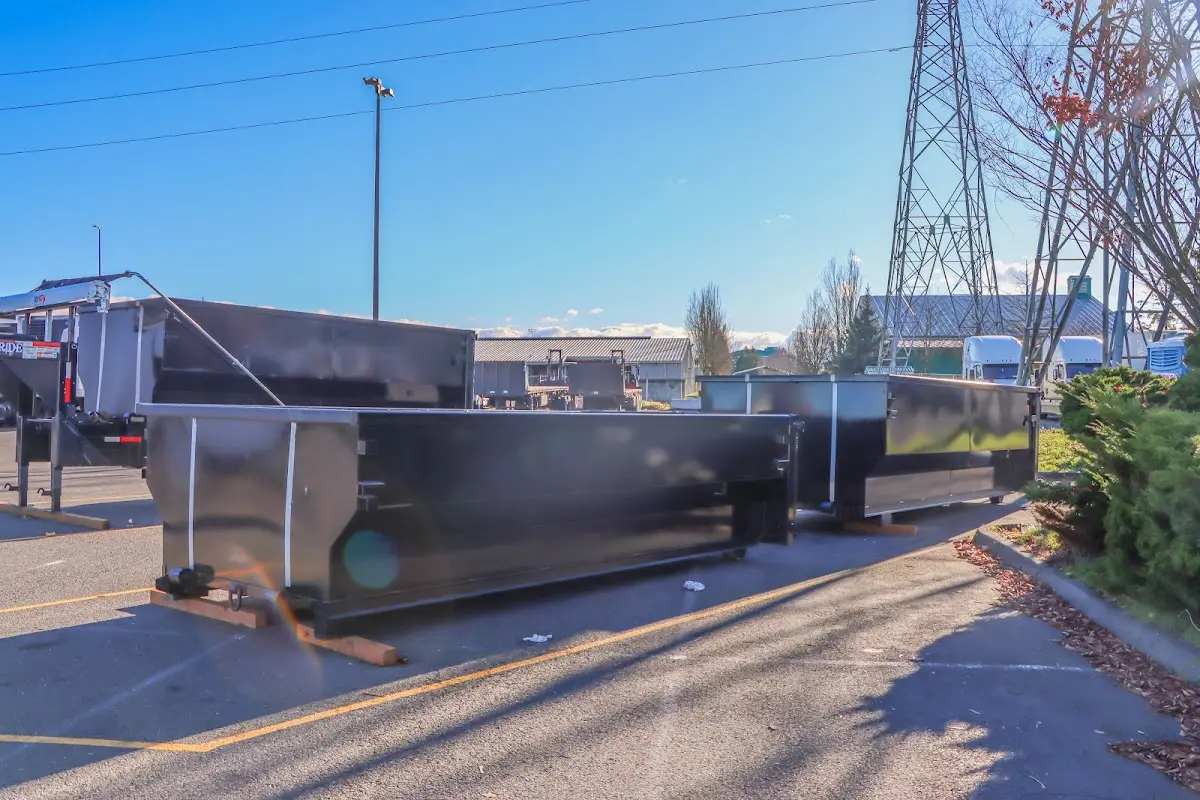 Roll-off dumpster ready for waste disposal at job site for 12 Yard Dumpster Rental in Warren